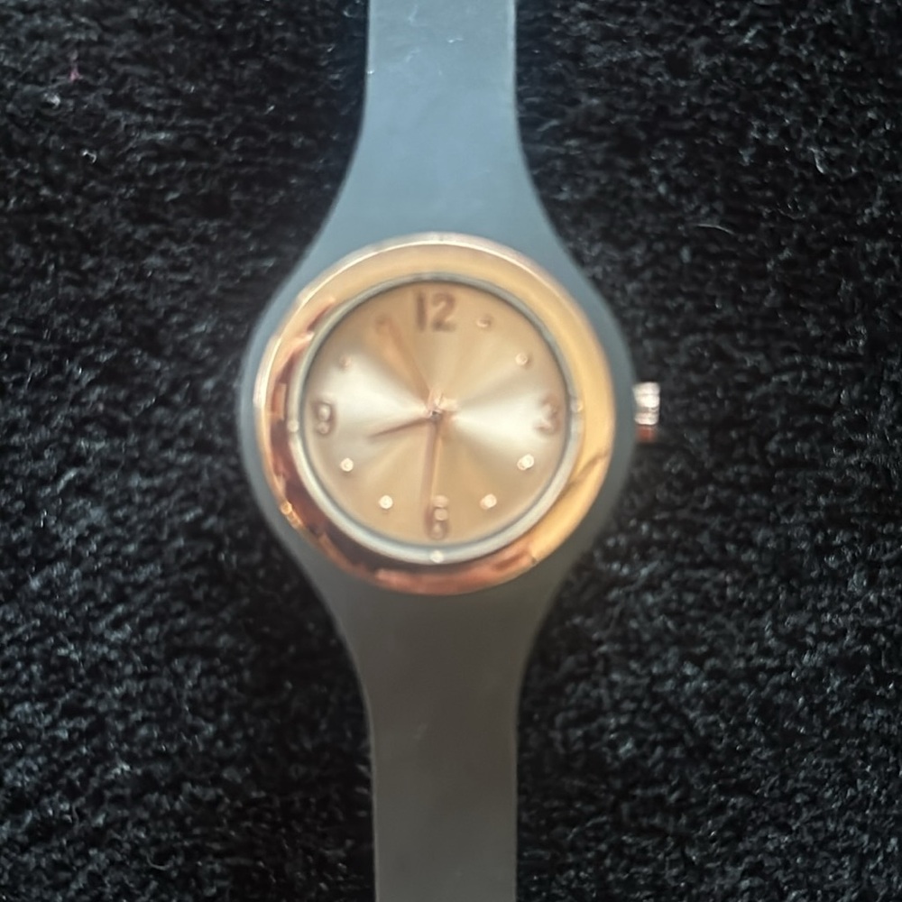Rose gold and black silicone watch